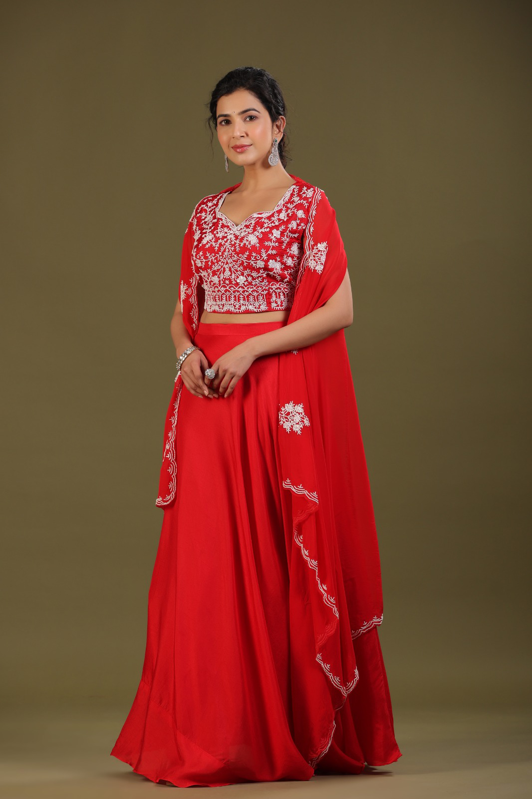 Beautiful silk set with a shrug and intricate detailing on the blouse and the shrug