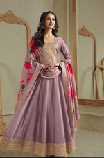 Soft shimmer tissue gown paired with floral dupatta in purple