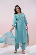 Muslin embroidery suit set paired with organza dupatta