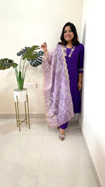 Festive appropriate muslin V neck zari embroidered suit set paired with organza dupatta