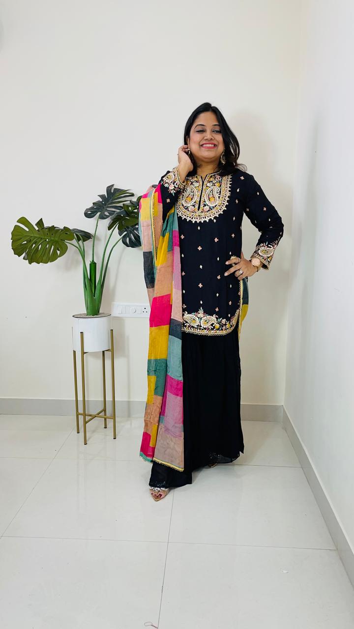 Beautiful dola silk kurta embellished with gotta work and paired with semi georgette sharara and a multi coloured organza dupattaComes with 2-4 inch margin