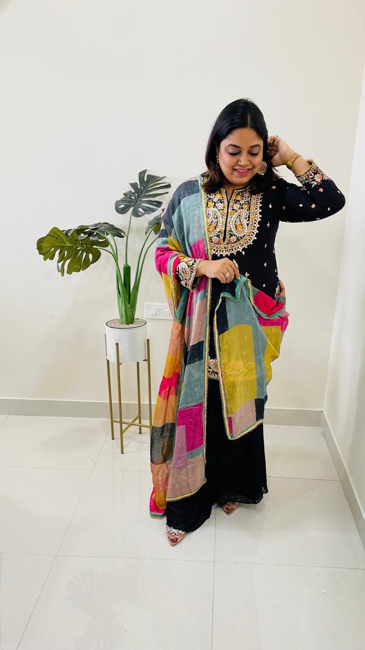 Beautiful dola silk kurta embellished with gotta work and paired with semi georgette sharara and a multi coloured organza dupattaComes with 2-4 inch margin